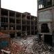 DETROIT, MI- DECEMBER 13: Graffiti is painted on the walls of the abandoned Packard Automotive Plant December 13, 2013 in Detroit, Michigan. Peru-based developer Fernando Palazuelo made his final payment on the Packard Plant, which he won during a Wayne County auction for $405,000. Palazuelo plans on developing the former automotive plant where luxury Packard cars were made in the coming years.